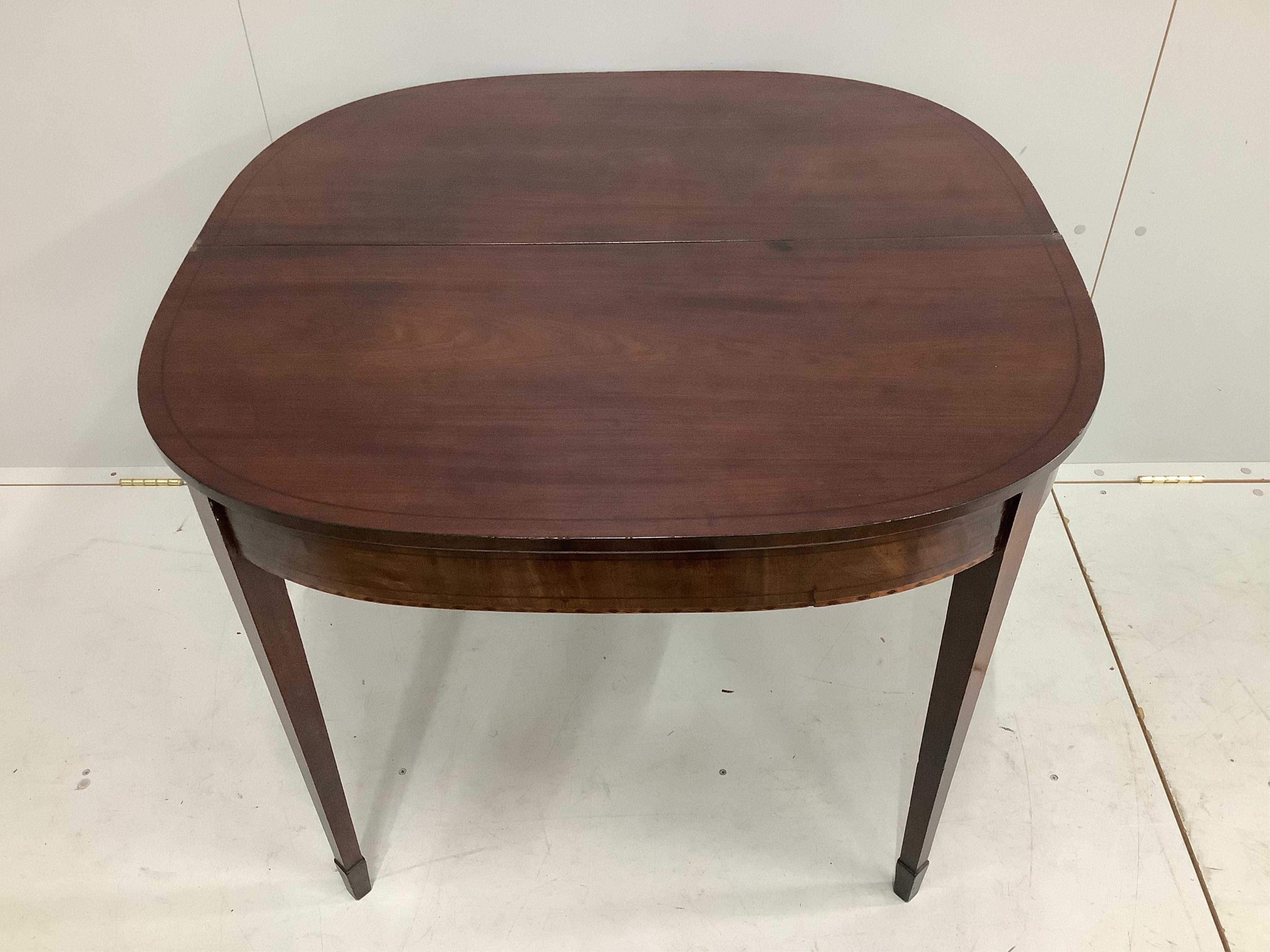 A Regency ebony strung mahogany folding tea table, width 92cm, height 74cm. Condition - fair to good